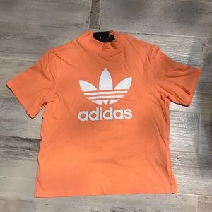 salmon colored adidas shirt